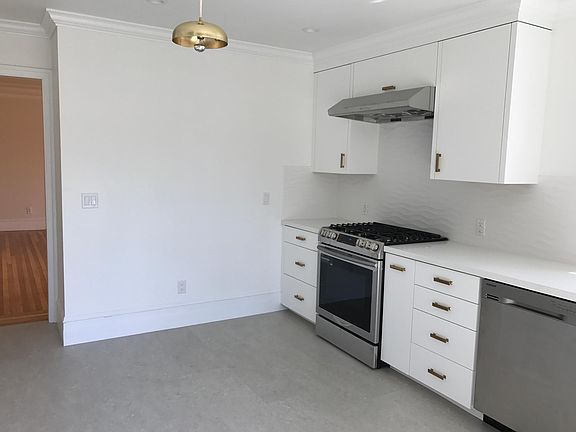 Kitchen and living room beyond.