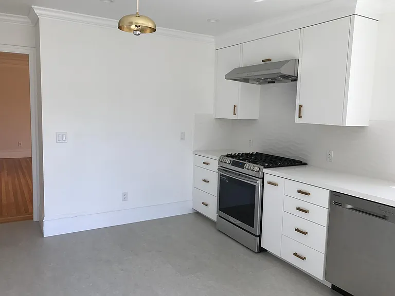 Kitchen and living room beyond.