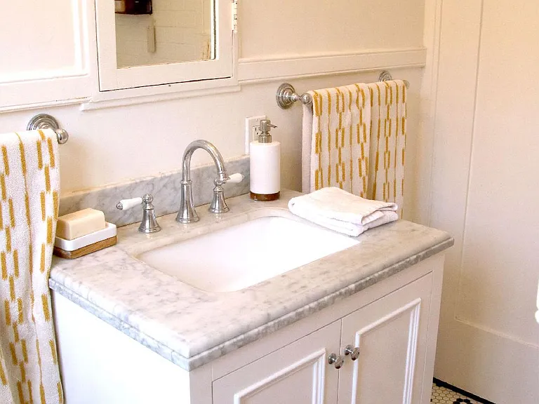 Renovated Bathroom with Marble Vanity in Charming 2 BDR/1 BA Retro Row Duplex Apartment.