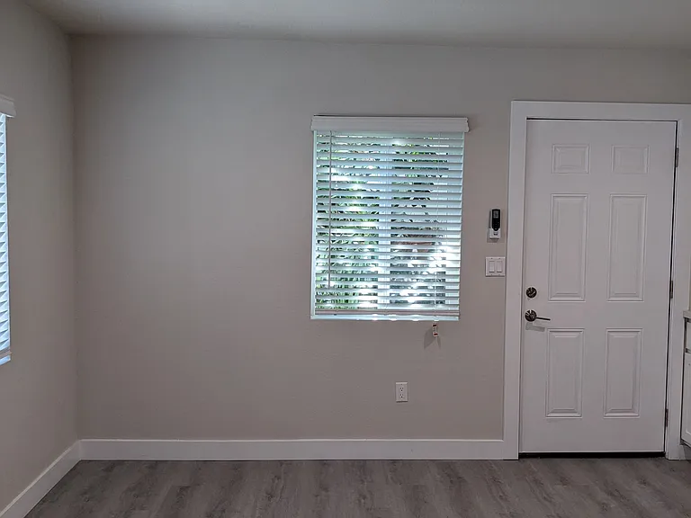 Large eating space with lots of natural lighting in kitchen at The Hardison Apartments in Pasadena, California.