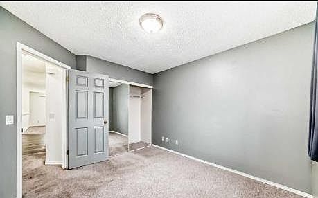 4th image of 202 E Saddlemead Grn NE