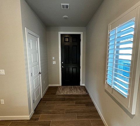 Front door, closet to the left