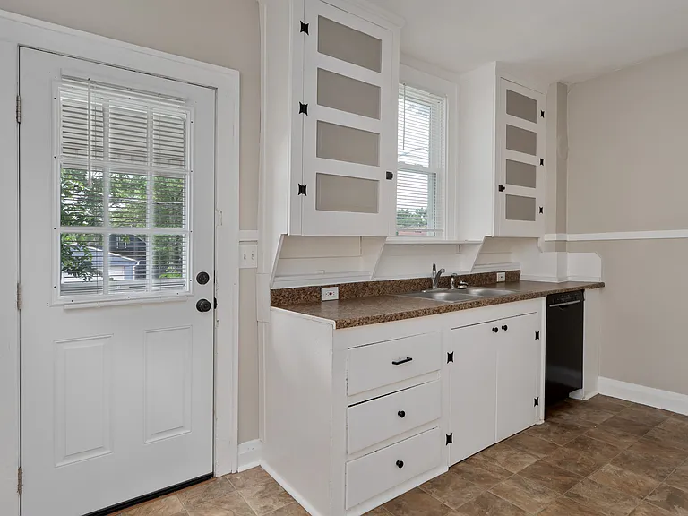 Kitchen includes Dishwasher, Refrigerator and Gas Range.