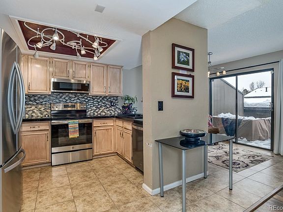 Updated kitchen with eating/reading nook opens to elevated deck.