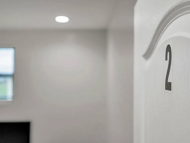 Cozy and newly renovated room with a comfortable bed, modern lighting, and a smart TV for your entertainment.