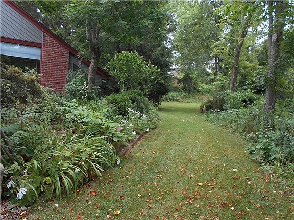 Side yard path leads to level back yard