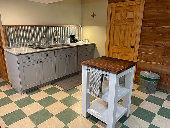 Gorgeous walnut butcher block island, ready for use! All kitchen essentials provided.