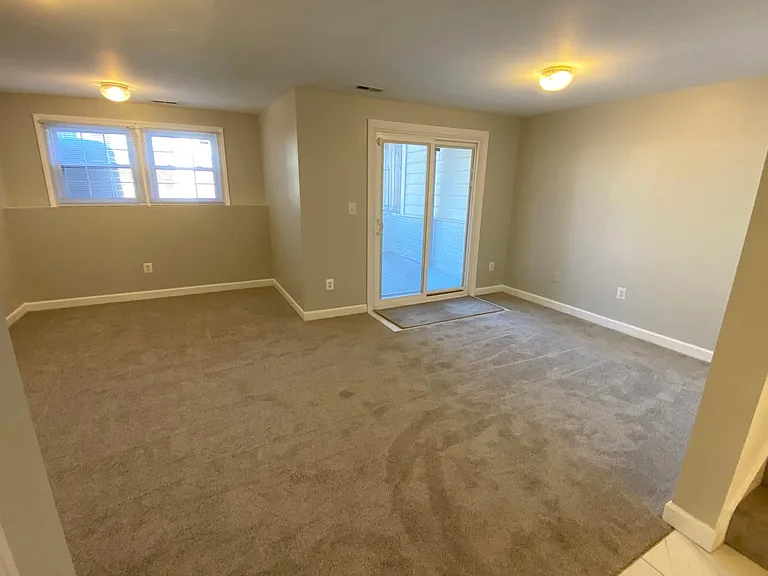 Large finished space in walk-out basement. Brand new carpet.