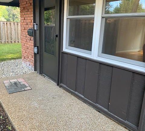 Covered front door entry steps away from parking