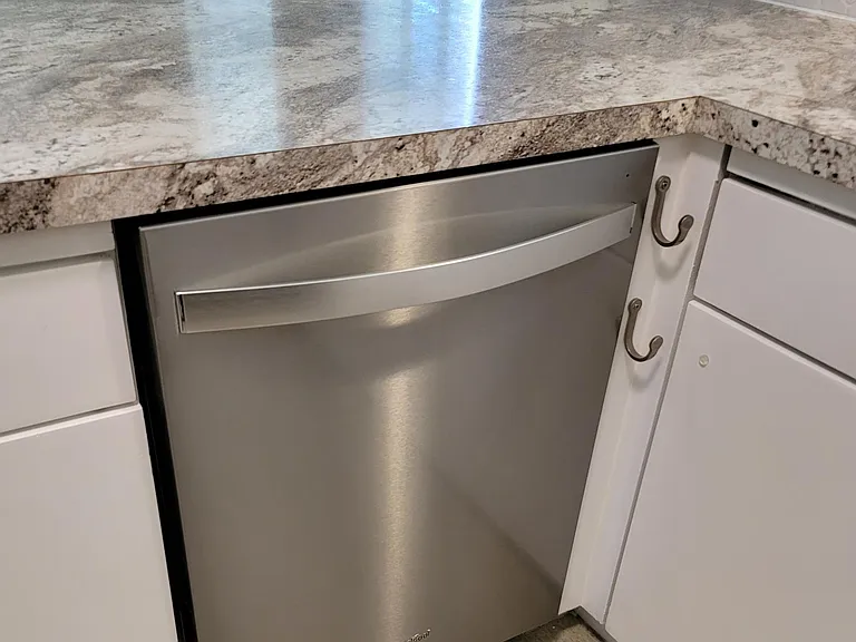 New Whirlpool Stainless Steele Dishwasher.