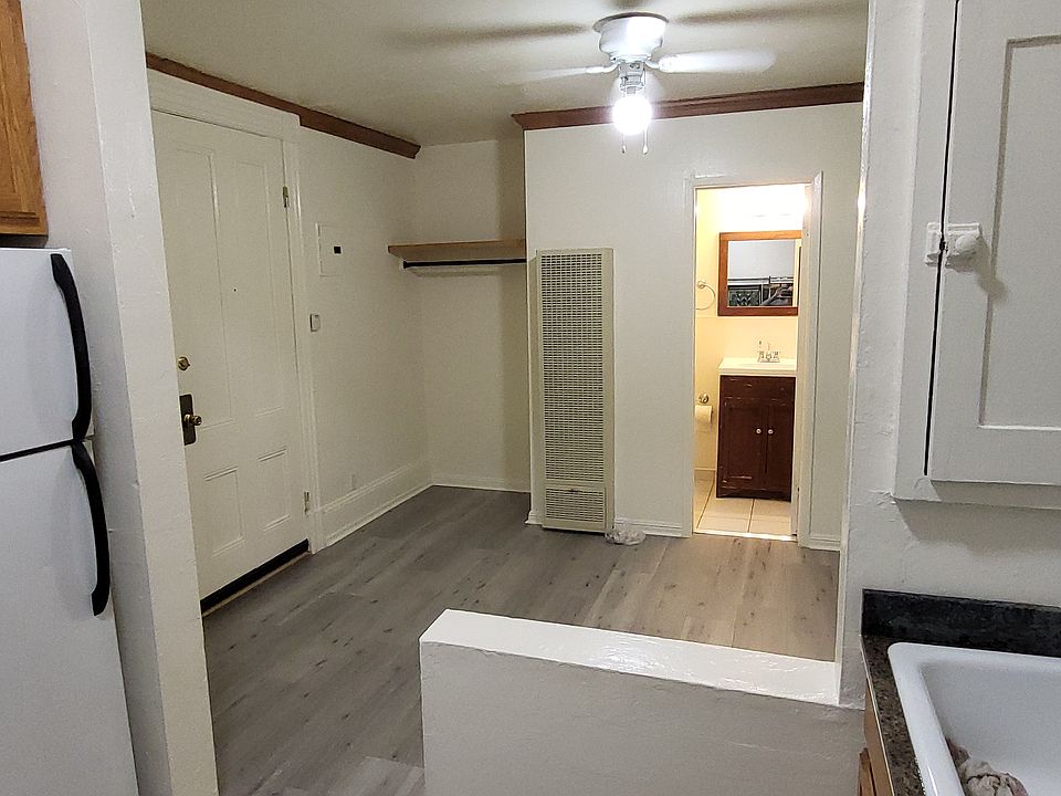 entire apartment from kitchen looking through bedroom to bathroom