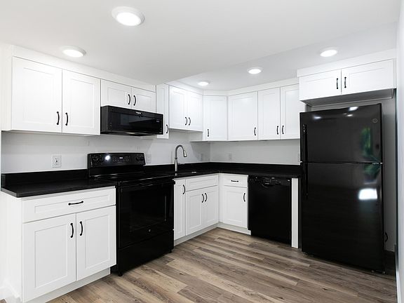 Kitchen with all new appliances, cabinetry, and granite countertops.