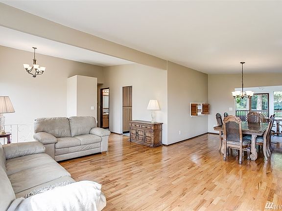 You'll find this home is ideal for entertaining. This open space will welcome large gatherings. Enjoy updated lighting in the entry and dining rooms. 