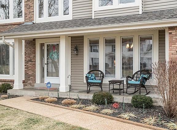 Your guest will be greeted by this spacious from porch.  All of the trim was recently wrapped with low maintenance aluminum.  Everything has been done to reduce maintenance and improve the efficiency of this home.