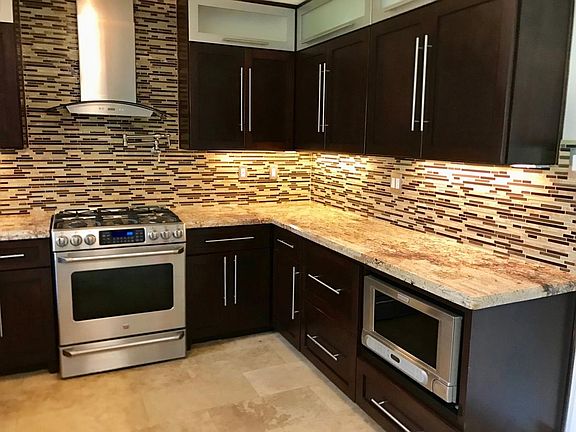 Remodeled Kitchen with Granite Countertops, Pot Filler, Stai