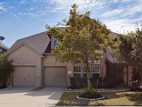 Great curb appeal and a double-wide driveway!  Two good sized trees in the front yard!