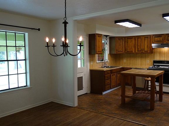 Central dining room open to living room and updated kitchen