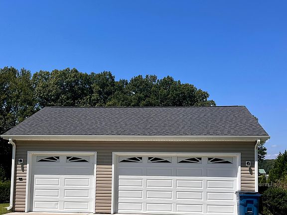 3 car garage connected to house by walkway