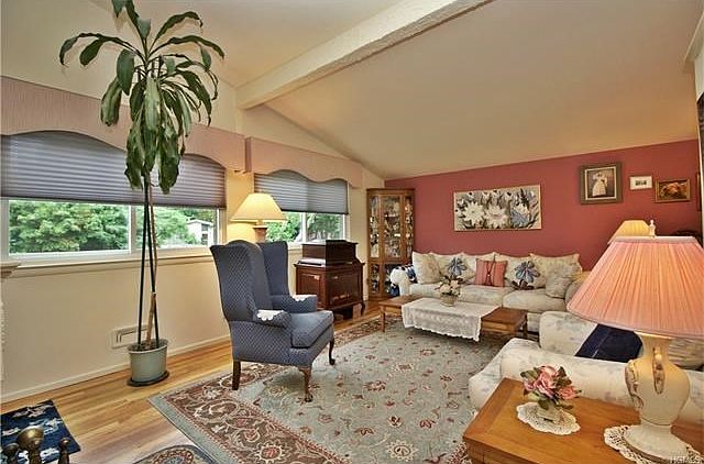 Formal living room with cathedral ceilings.