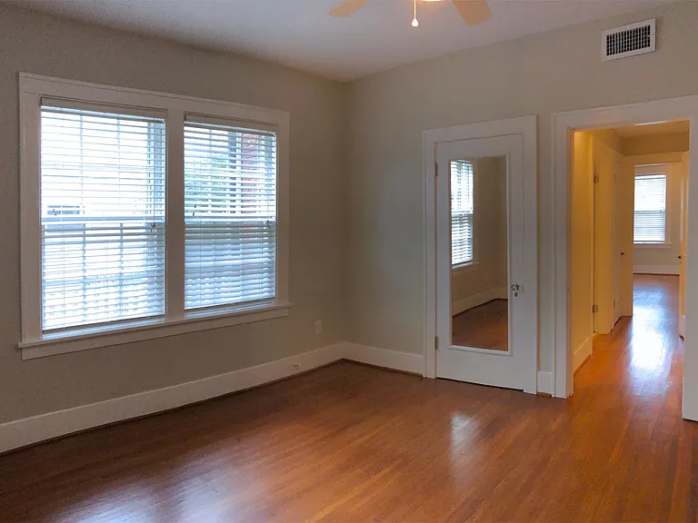 Middle bedroom with mirrored closet door. Also can work as a