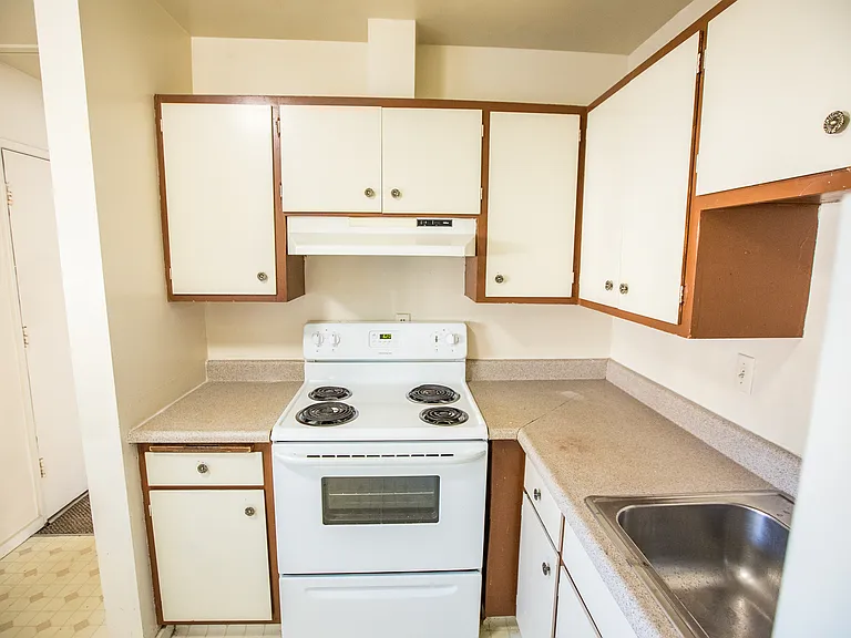 Full kitchen with new granite counter top just replaced after this picture