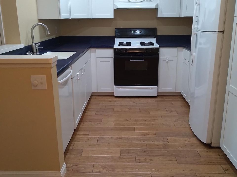 Remodelled Kitchen with dark blue corian countertops