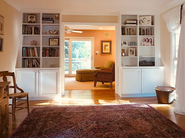 Living Room/Flex Room facing den and sliding glass door to deck.