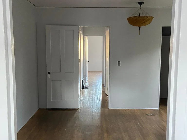 looking down the hallway from the main bedroom