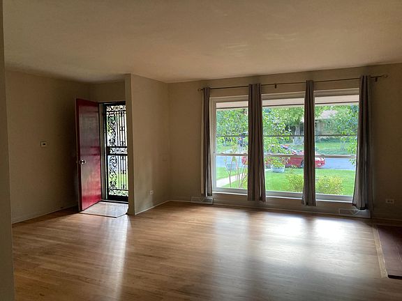 Standing in dining room area looking out the front window and front door