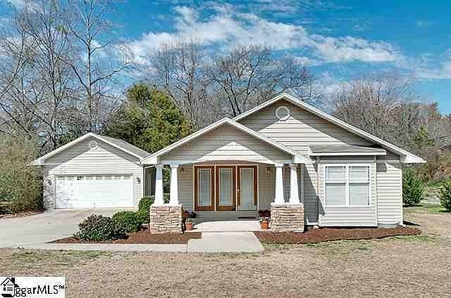 Front patio, detached garage, large front yard