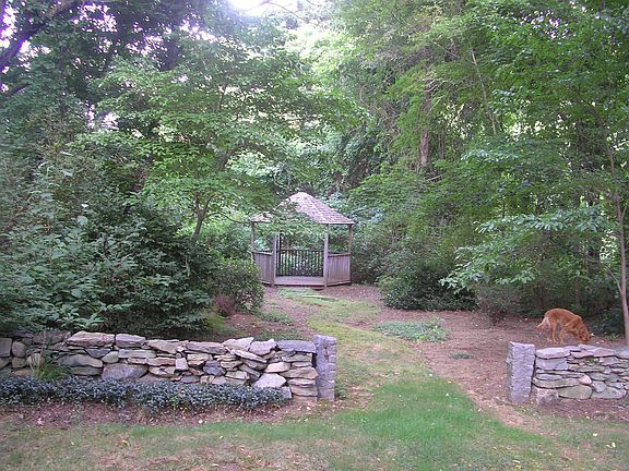 woodland path to a gazebo
