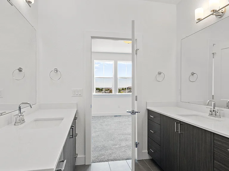 Primary Suite 5 Piece Bath including dual sinks across from one another w/Upgraded Fixtures & Countertops