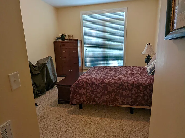 Downstairs guest bedroom with oversized windows.