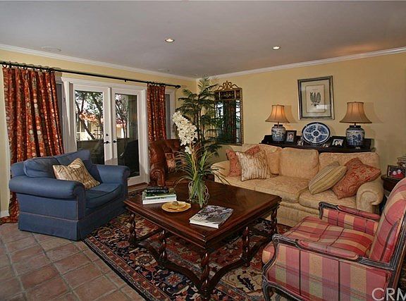 Living room with french doors to wrap around patio