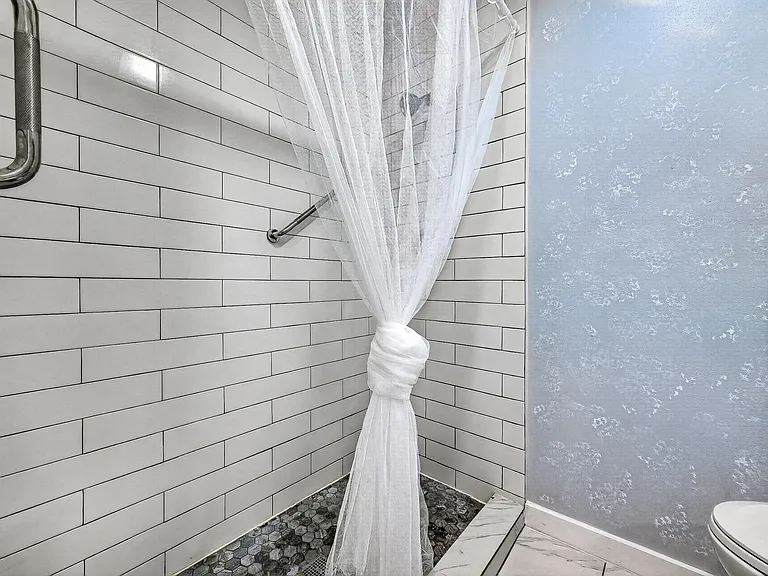 Shower in the bathroom upstairs.