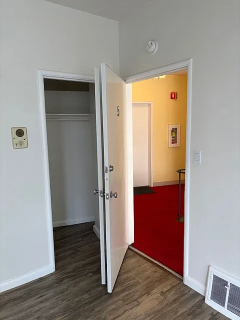 View of front door from inside apartment