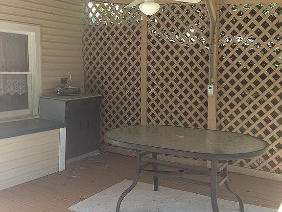 Porch by pool with fan