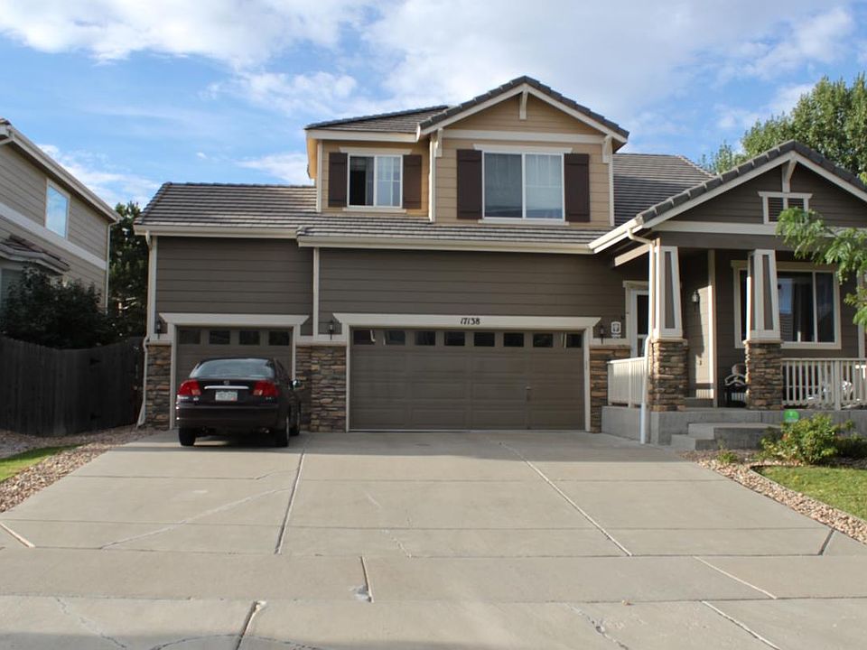 Grand Elevation with 3 car garage and concrete tile roof