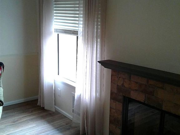 Big window with wood fireplace 