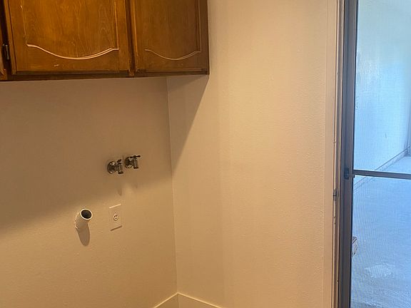 Laundry room with cabinets