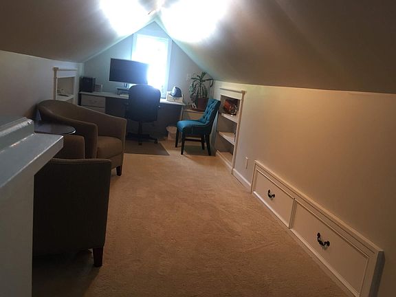 Upstairs office with built-in bookshelves. Drawers on the right pull out for a twin-sized mattress!