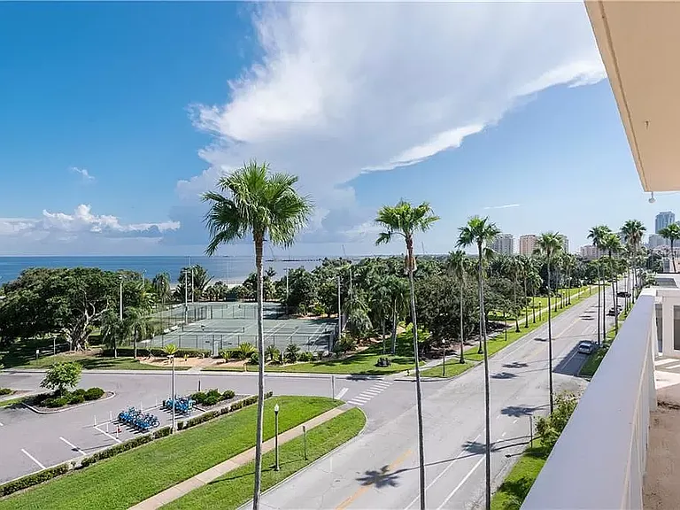 View of tennis courts from condo's balcony