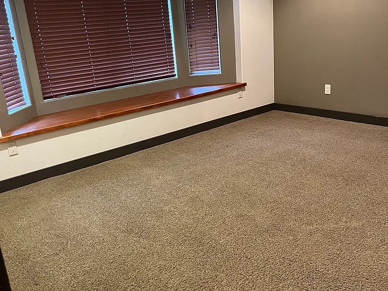 Left side of master bed with window seat