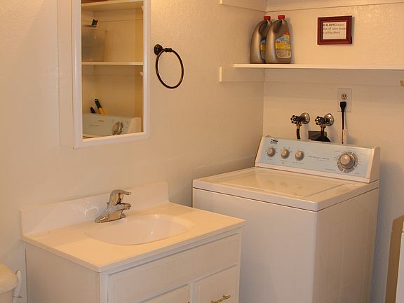 Laundry room with half bath