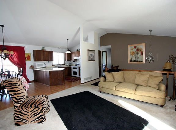 Upper level featuring LR, DR and Kitchen w/breakfast bar