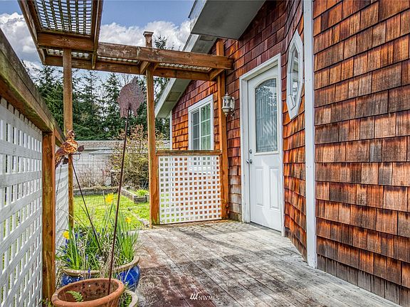 Front porch entrance good spot for a few pots yet plenty of room to greet guests.