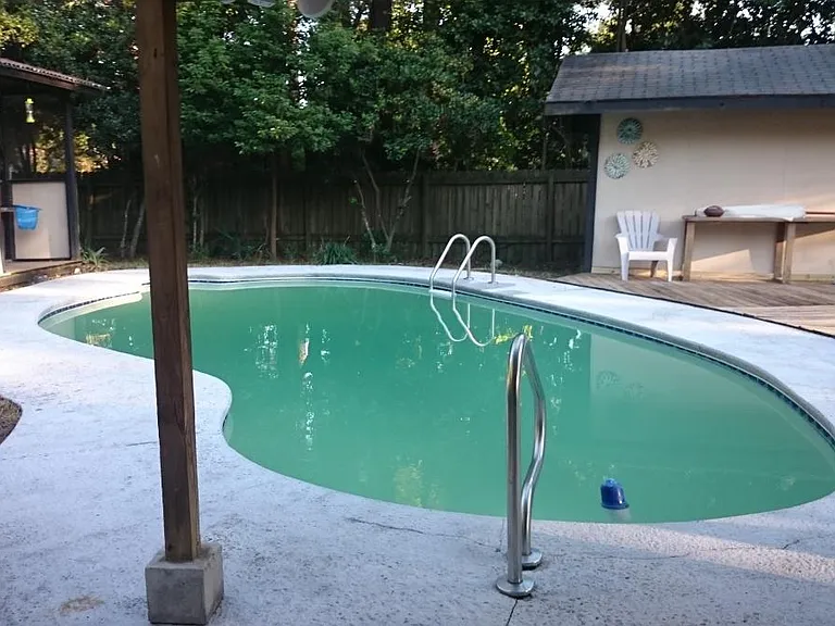 large inground pool with DE filtration system maintained by local pool company weekly- fee included in rental amount