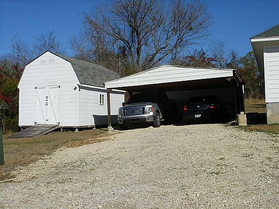 2 car carport with storage house.
