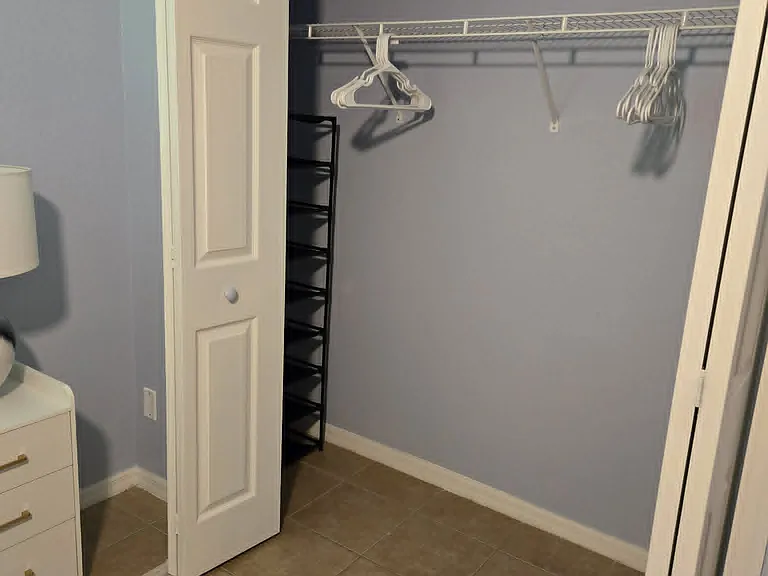 Spacious closet located next to the bed with dedicated shoe stands on both sides, perfect for keeping your shoe collection organized and easily accessible. A great feature for anyone who loves having plenty of space for their favorite pairs.