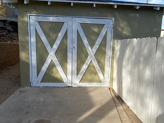 garage and adjacent fenced yard.